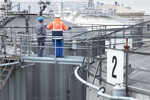 Picture of tank farm/ oil tanks in a refinery. Endress+hauser together with customer.